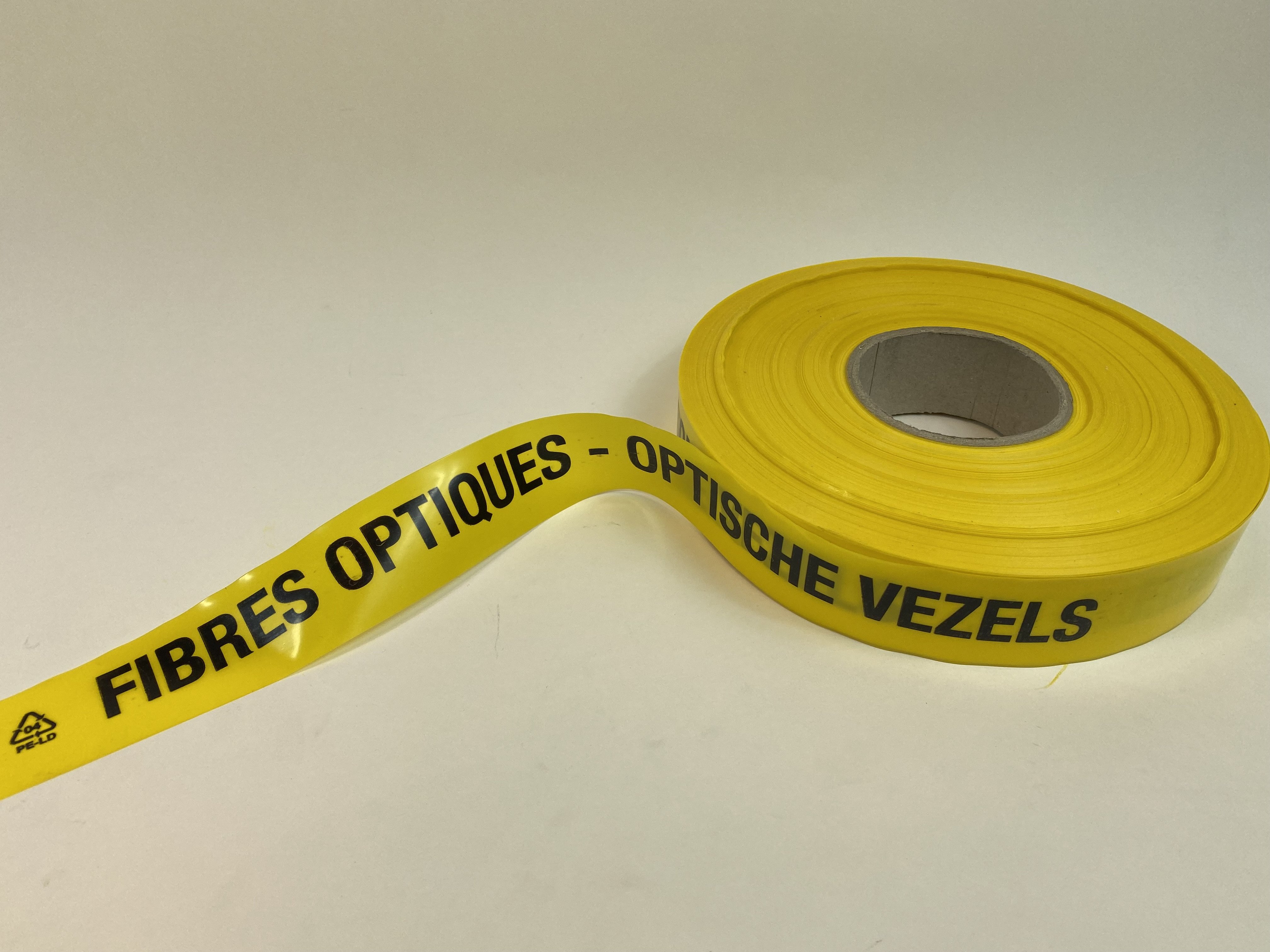 RUBAN AVERTISSEUR JAUNE 40 mm  'FIBRES OPTIQUES' -  'OPTISCHE VEZELS'